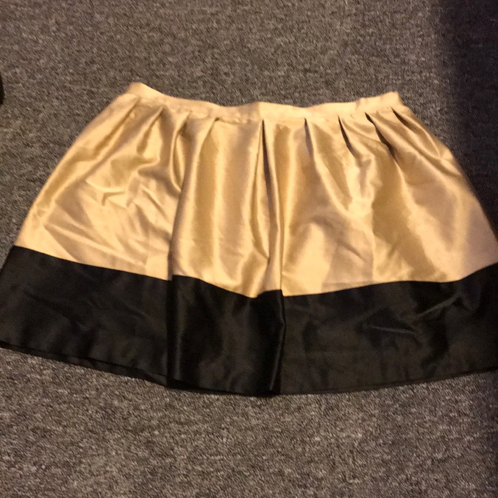 Gold with black trim women’s skirt.